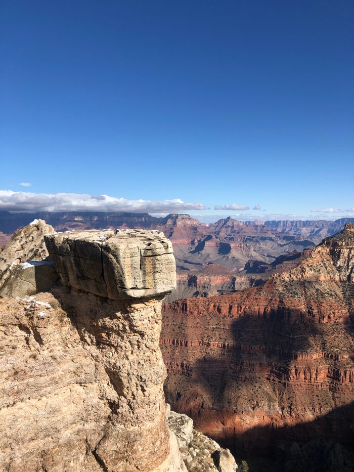 Breathtaking landscape of the Grand Canyon under a clear blue sky.